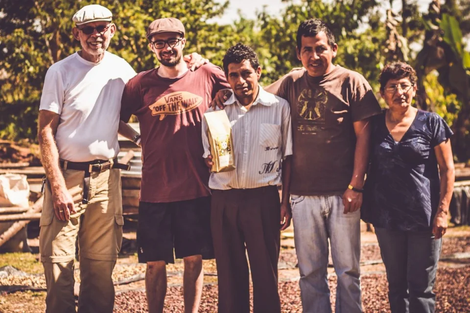 A group stands together outdoors in the Miguel Grau series from Panda Coffee’s Peru archive.